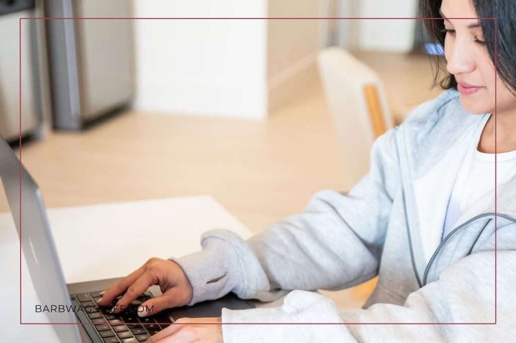 woman's hands on a keyboard