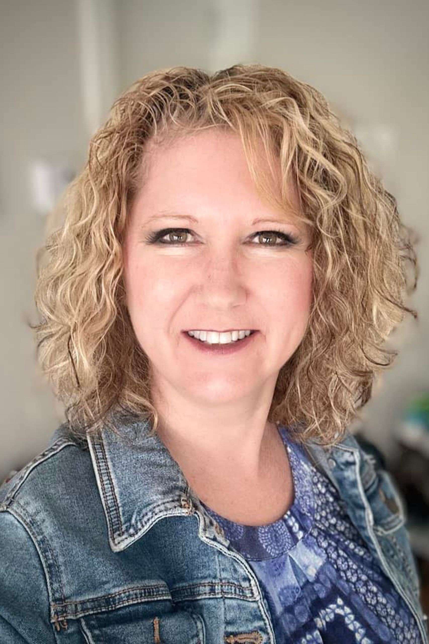 Barb Wagstaff wearing jean jacket and blue top